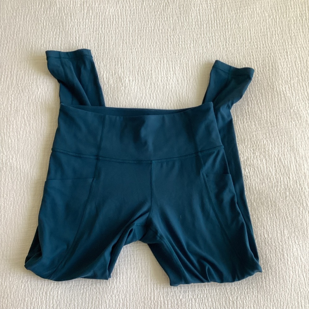 Athleta Stash Pocket Salutation Tight Leggings Dark Blue